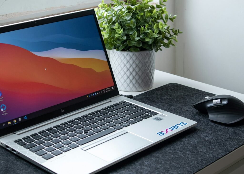 A laptop open on a desk, part-way through building a website