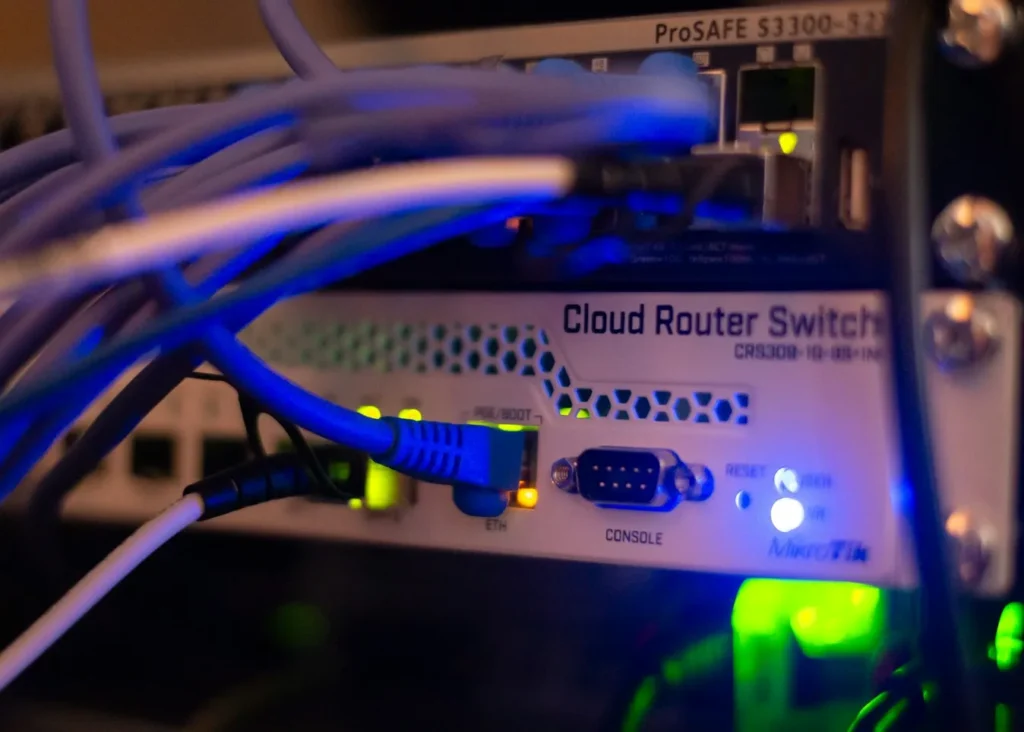 Close-up of network cables in a server rack, representing website hosting